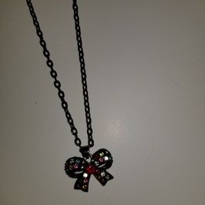 Bow necklace with rainbow jewels